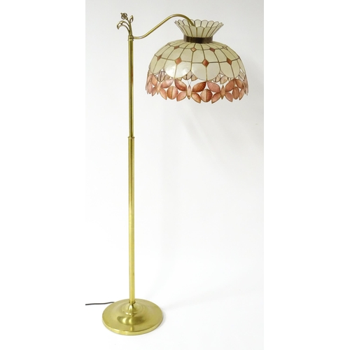 6 - A brass standard lamp with leaded glass shade, together with three table lamps . The table lamps app... 
