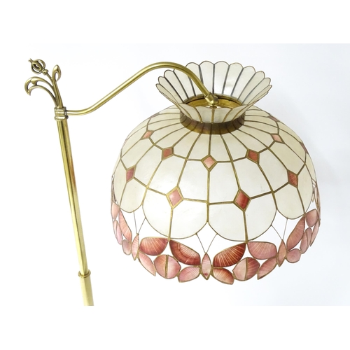 6 - A brass standard lamp with leaded glass shade, together with three table lamps . The table lamps app... 