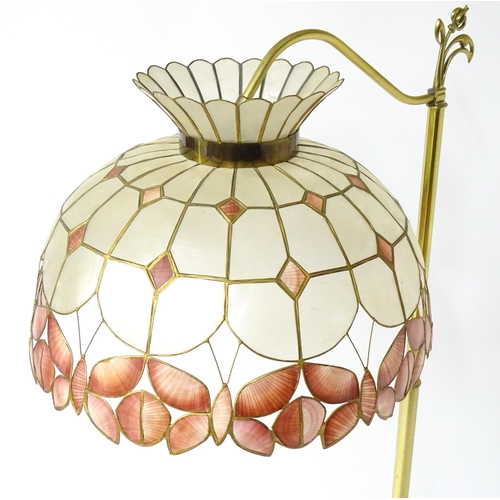 6 - A brass standard lamp with leaded glass shade, together with three table lamps . The table lamps app... 