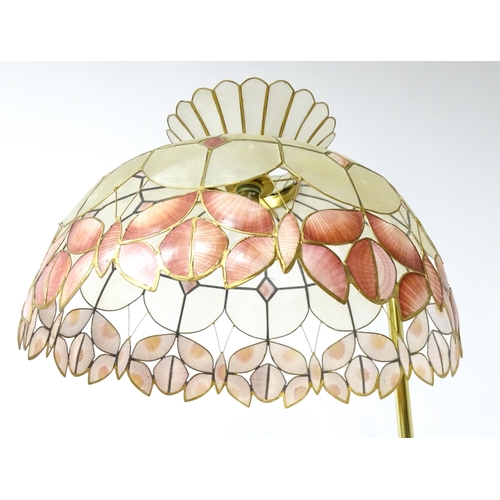 6 - A brass standard lamp with leaded glass shade, together with three table lamps . The table lamps app... 