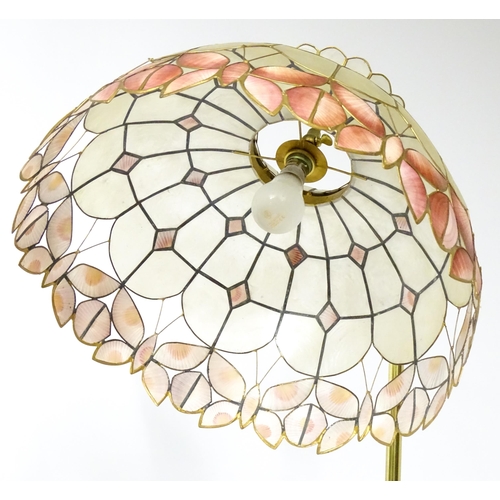 6 - A brass standard lamp with leaded glass shade, together with three table lamps . The table lamps app... 