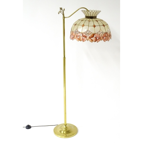 6 - A brass standard lamp with leaded glass shade, together with three table lamps . The table lamps app... 