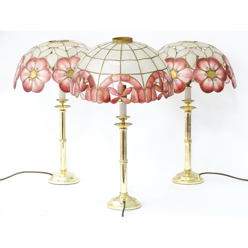 6 - A brass standard lamp with leaded glass shade, together with three table lamps . The table lamps app... 