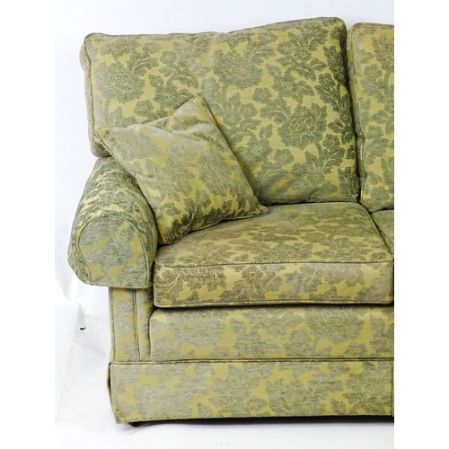 23 - A modern two seater sofa. 64