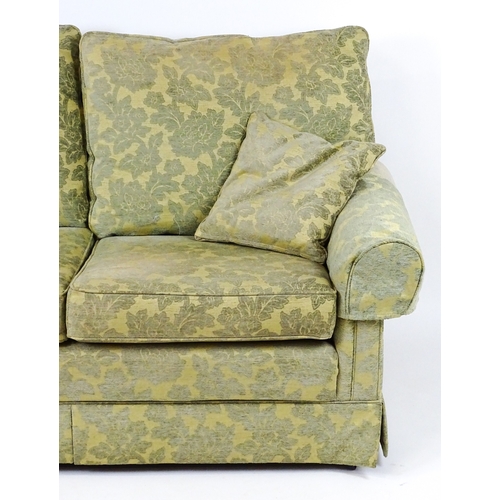 23 - A modern two seater sofa. 64