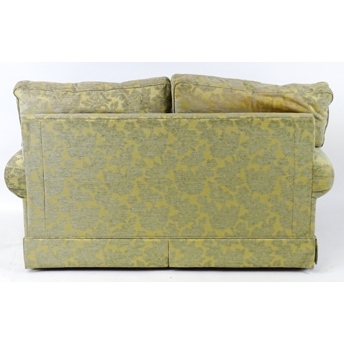 23 - A modern two seater sofa. 64