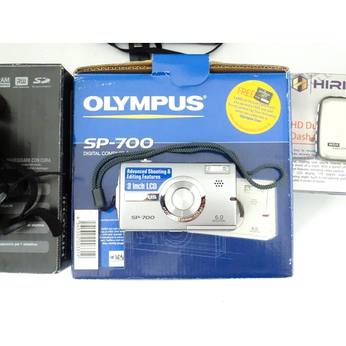 29 - A quantity of assorted cameras to include a Pentax Optio 330, a Hirix HD dual lens dash cam, an Olym... 