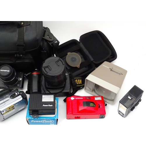 29 - A quantity of assorted cameras to include a Pentax Optio 330, a Hirix HD dual lens dash cam, an Olym... 