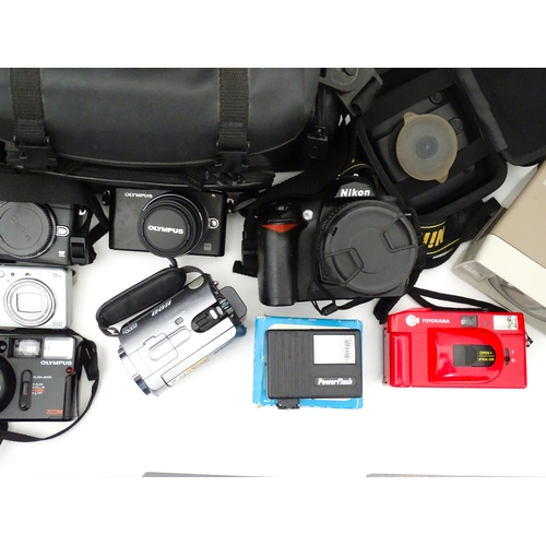 29 - A quantity of assorted cameras to include a Pentax Optio 330, a Hirix HD dual lens dash cam, an Olym... 