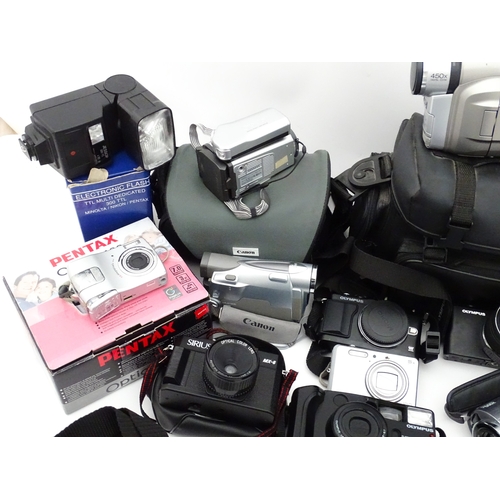 29 - A quantity of assorted cameras to include a Pentax Optio 330, a Hirix HD dual lens dash cam, an Olym... 