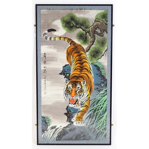 A Chinese watercolour scroll painting depicting a prowling tiger. Signed with Character marks and seal. Approx. 56 3/4" x 30 1/4" overall