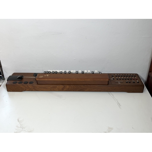 35 - Suzuki TES-100 Waraku Koto Synth, complete with hardcase/accessories.
These are great fun – lots of ... 