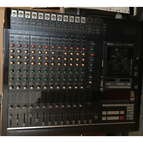 48 - Akai MG1212 12-Channel Mixer / Recorder

Assumed non-functional. Some damage to the tape cassette do... 