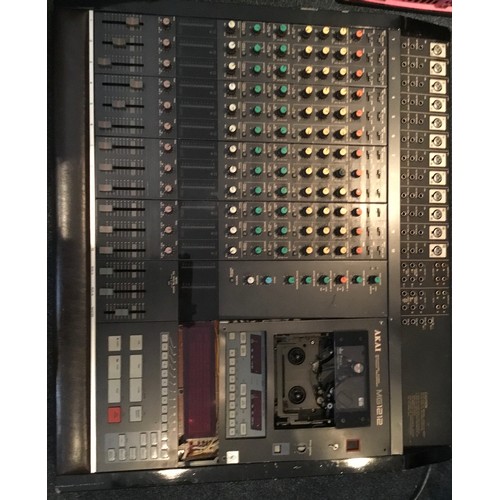 48 - Akai MG1212 12-Channel Mixer / Recorder

Assumed non-functional. Some damage to the tape cassette do... 