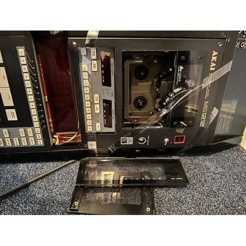 48 - Akai MG1212 12-Channel Mixer / Recorder

Assumed non-functional. Some damage to the tape cassette do... 