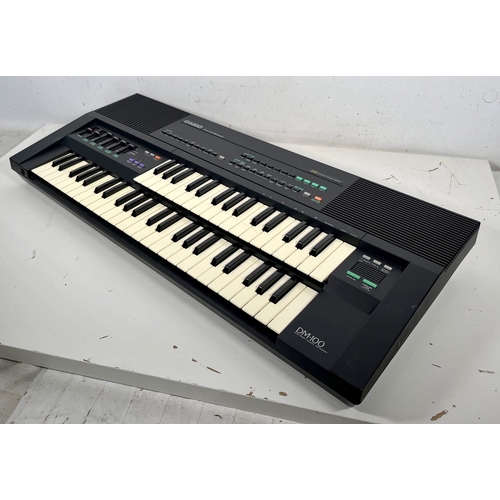 133 - Casio DM-100.

Rare dual keyboard synth/sampler with some classic Casio preset sounds.

(B) Tested a... 