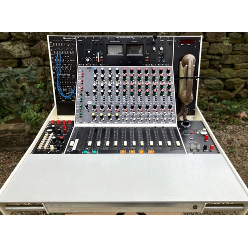 Glensound (Ex-BBC) Broadcast Mixing Desk GSNT/1. Complete with original service manuals & schematics. 
A very unusual piece of broadcasting history - an 11(!) channel BBC spec studio broadcast desk from which seems to date from the early 1980s.
*Note that this is a brokerage sale item - all info below is from the seller.

This was designed as a very elaborate "plug and play" studio hub device of its day which thinks of everything it could possibly have had coming into it or going out of it back in the days of tape machines, music lines, gram decks and green cue lights. Comprises of 4 hi spec mic channels and 7 "repro" (+6db line level) channels, the last of which is dedicated to "Gram deck" inputs. Each channel has Glensound's bespoke RSA eq, a Misc (aux) send and, in the case of the mics, a pan pot.  Also an "output bypass" which can send a separate bus away from the main output. Faders are P&G BBC spec so they open "the wrong way round" in the tradition of the time at the corporation (i.e. pull towards the user to increase gain). Fader start functionality is available for each channel with ""red light""/mute monitor switching for the mics. There are also wire-able "hotkeys" below this for fader start or green light announcer cue functions. The unit is self contained for all studio functionality including headphone and control room/studio speaker monitoring, monitor routing matrix and ring main monitoring selector, dual PPM metering, elaborate tone generation, talkback mic and facilities, PPL circuits (the logic of this is a bit muddled and baffled even a BBC engineer who serviced it but it works after a fashion). There is a bantam jack patch bay (I have examples of the leads to include) EDAC connections for much of the function on the back (ditto) as well as standard XLR ins and outs for mics, grams and speaker. It comes with a full service manual bespoke to the BBC mods this particular example has had which explains the full back panel connectivity and myriad of possibilities available. Extra historic features that add to the "Tardis quality" of this item include functionality around the old Cue and Control line outside broadcast practises of the BBC which includes a "linesman's phone" built into the right hand side. There are also facilities for reel to reel tape recorder monitoring "off repro head" during recording on left hand red switches 1 to 4 and even a vari-speed remote control for an A80 Studer machine. A time counter display at the top right of the unit adds an extra curio.

Dry stored for the last 3 years, it was previously functional in a private studio for 10 years during which time it had a full overhaul by a BBC qualified engineer. It has its eccentricities in keeping with a unit of this age - there will be scratchy pots and minor oddities and, although much of this was attended to at the last service, I would recommend that it is checked and serviced again by a fully qualified electrical engineer before being put into full use. No guarantee or warranty implied.