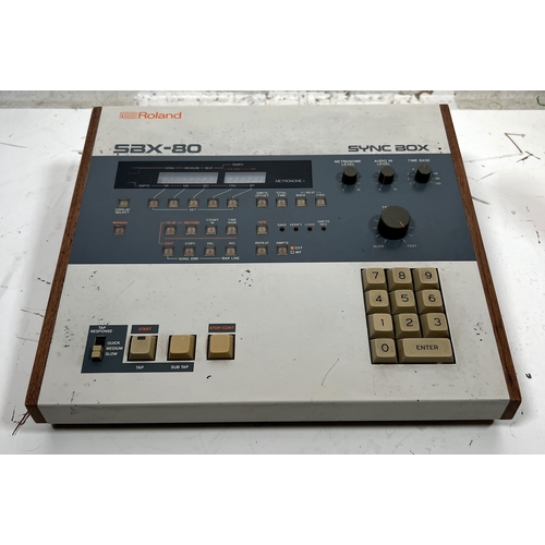 72 - Roland SBX-80 Sync Box

Device for synchronizing various music hardware with precise timing control.... 