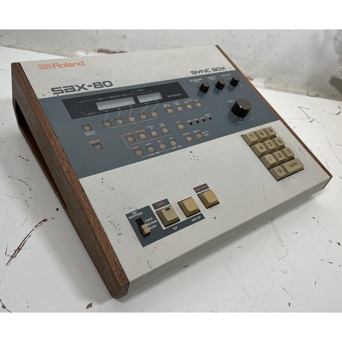 72 - Roland SBX-80 Sync Box

Device for synchronizing various music hardware with precise timing control.... 