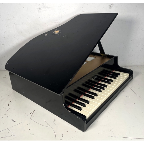 46 - Kawai Mini Grand Toy Piano 1104 

No legs.

Tested and working. 
No guarantee or warranty implied. O... 