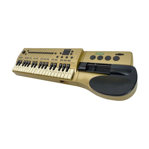 10 - Suzuki TES-371 digital electric taishogoto/koto synth

It's a synth, with strings, and drum pads and... 