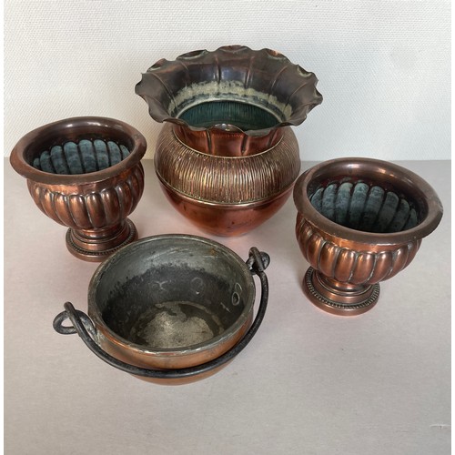 118 - Four copper containers including urns and vase