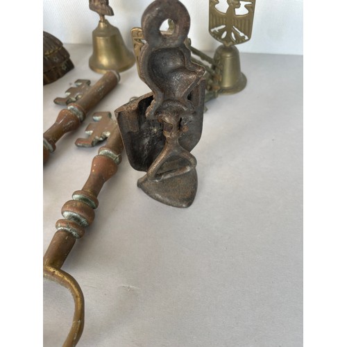 119 - A quantity of brass items including keys and bells