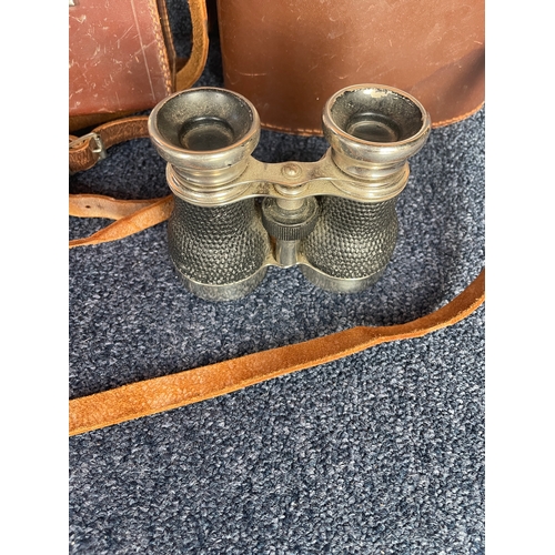 114 - A pair of opera glasses and two leather unassociated binocular cases - one Pathescope, one Ross of L... 