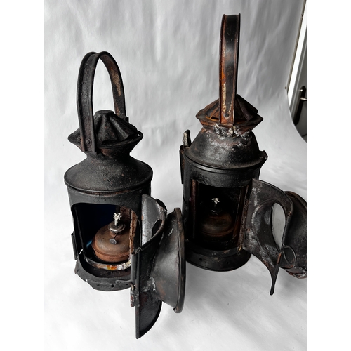 115 - Two vintage Indian Railway Signal Lamps complete with internal lenses and oil burners.