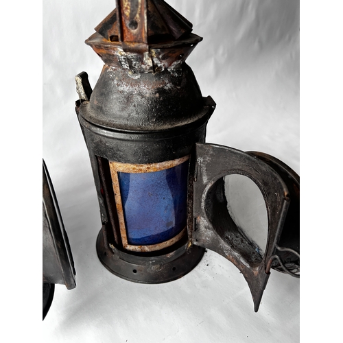 115 - Two vintage Indian Railway Signal Lamps complete with internal lenses and oil burners.
