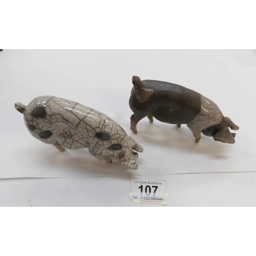 107 - 2 ceramic pig figures