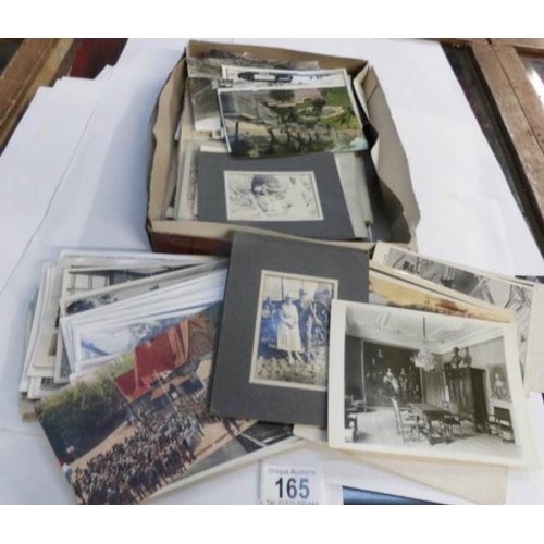 165 - A mixed lot of old postcards, photographs etc