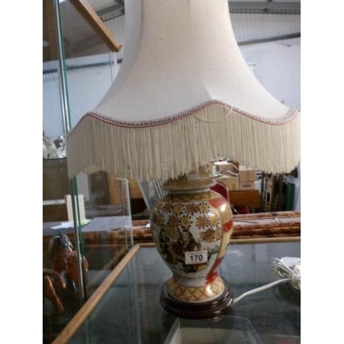 170 - An oriental style table lamp with shade