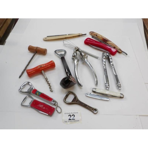 22 - A mixed lot of pen knives, bottle openers, nut crackers etc