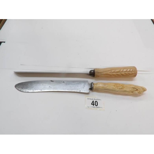 40 - 2 ivory handled bread knives, one corn on the cob and one wheat