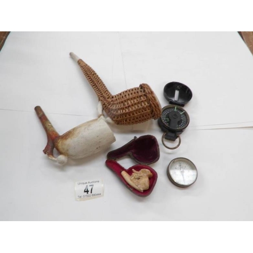 47 - 2 compasses, a meerscham pipe and 2 clay pipes with a mounted foot and football