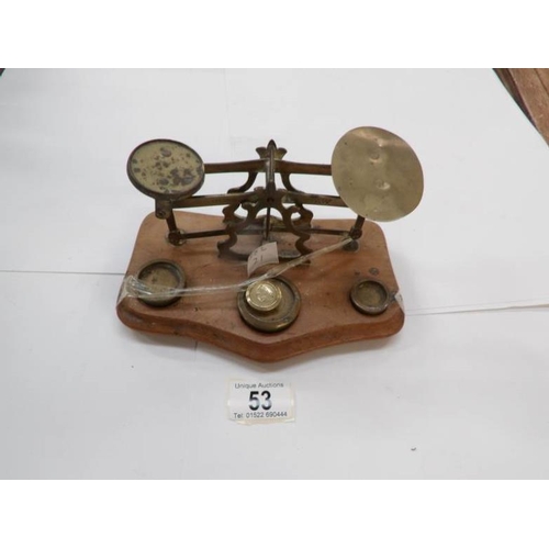 53 - A set of brass and wood postal scales