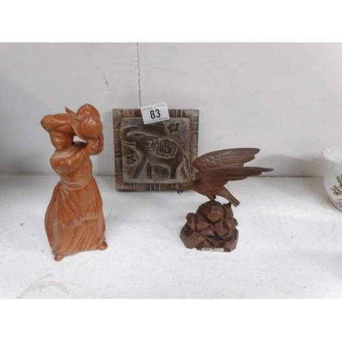 83 - A carved wood figure, carved wood eagle and carved wood plaque