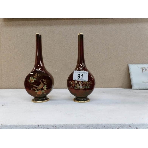 91 - 2 Carlton ware red lustre medallion vases, Oriental design and pheasant design