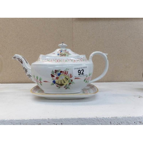 92 - An early 19th century Newhall teapot with stand