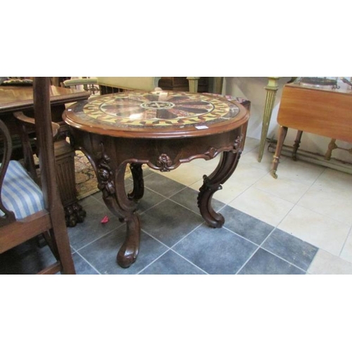 1778 - An Italian carved table with decorative marble top