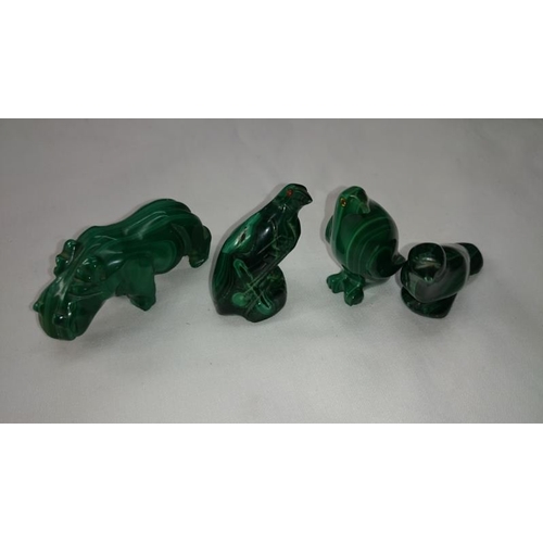 28 - 3 Inuit figures and 4 carved malachite animal figures

There are no markings on any of this lot