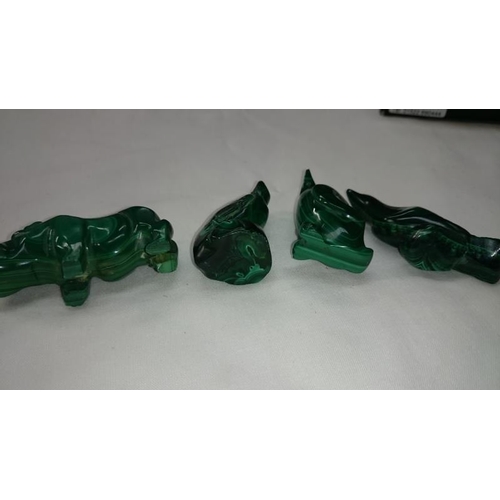 28 - 3 Inuit figures and 4 carved malachite animal figures

There are no markings on any of this lot