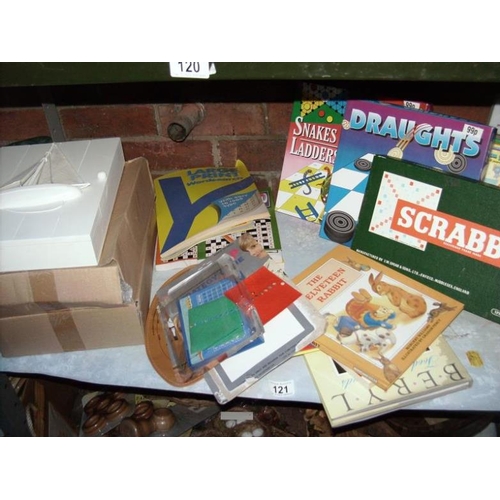 121 - A shelf of wooden items and games