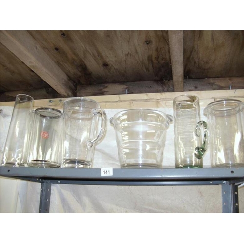 141 - A shelf of glass vases etc