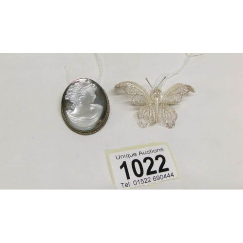 1022 - A silver and carved mother of pearl brooch and a silver filigree butterfly brooch