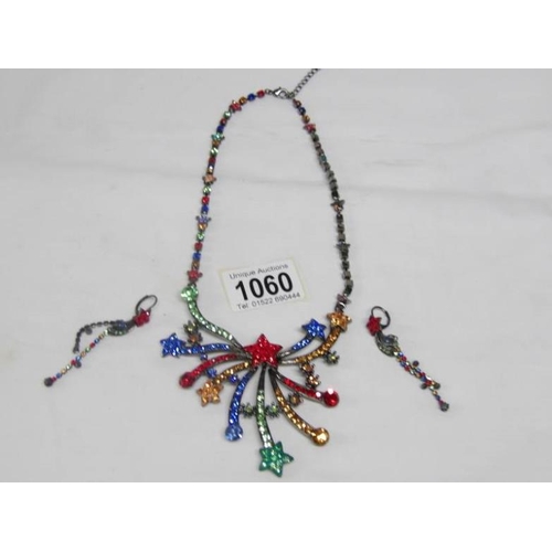 1060 - A Butler and Wilson starburst crystal necklace with matching drop earrings