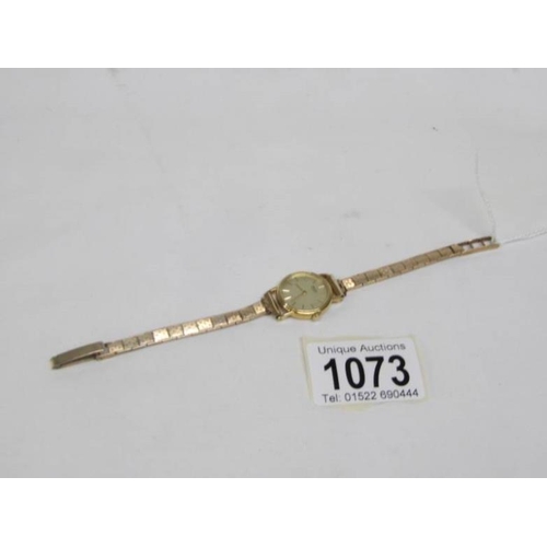 1073 - A 9ct gold ladies Seiko wristwatch on 9ct gold strap