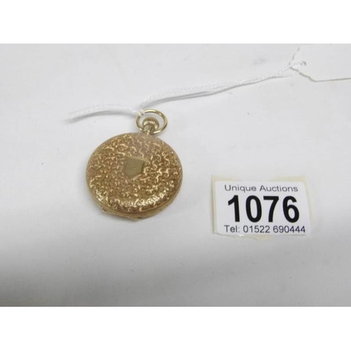 1076 - An 18ct gold fob watch