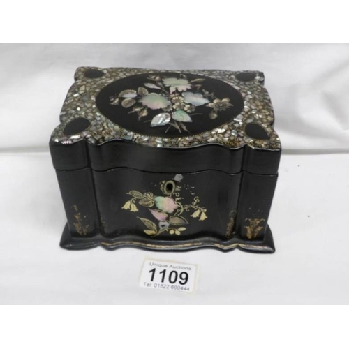 1109 - A lacquered tea caddy inlaid with mother of pearl